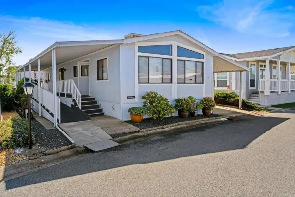 a front view of a house with yard