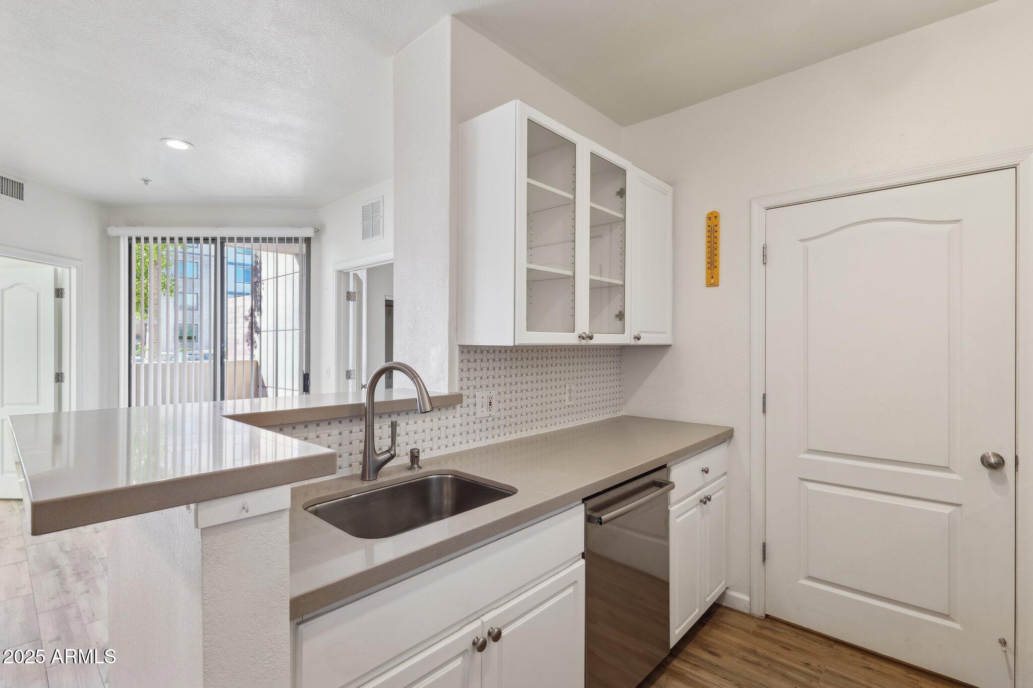 1701 East Colter Street, Unit 182 Phoenix, AZ 85016 - Photo 10 of 55 a kitchen with a sink and cabinets