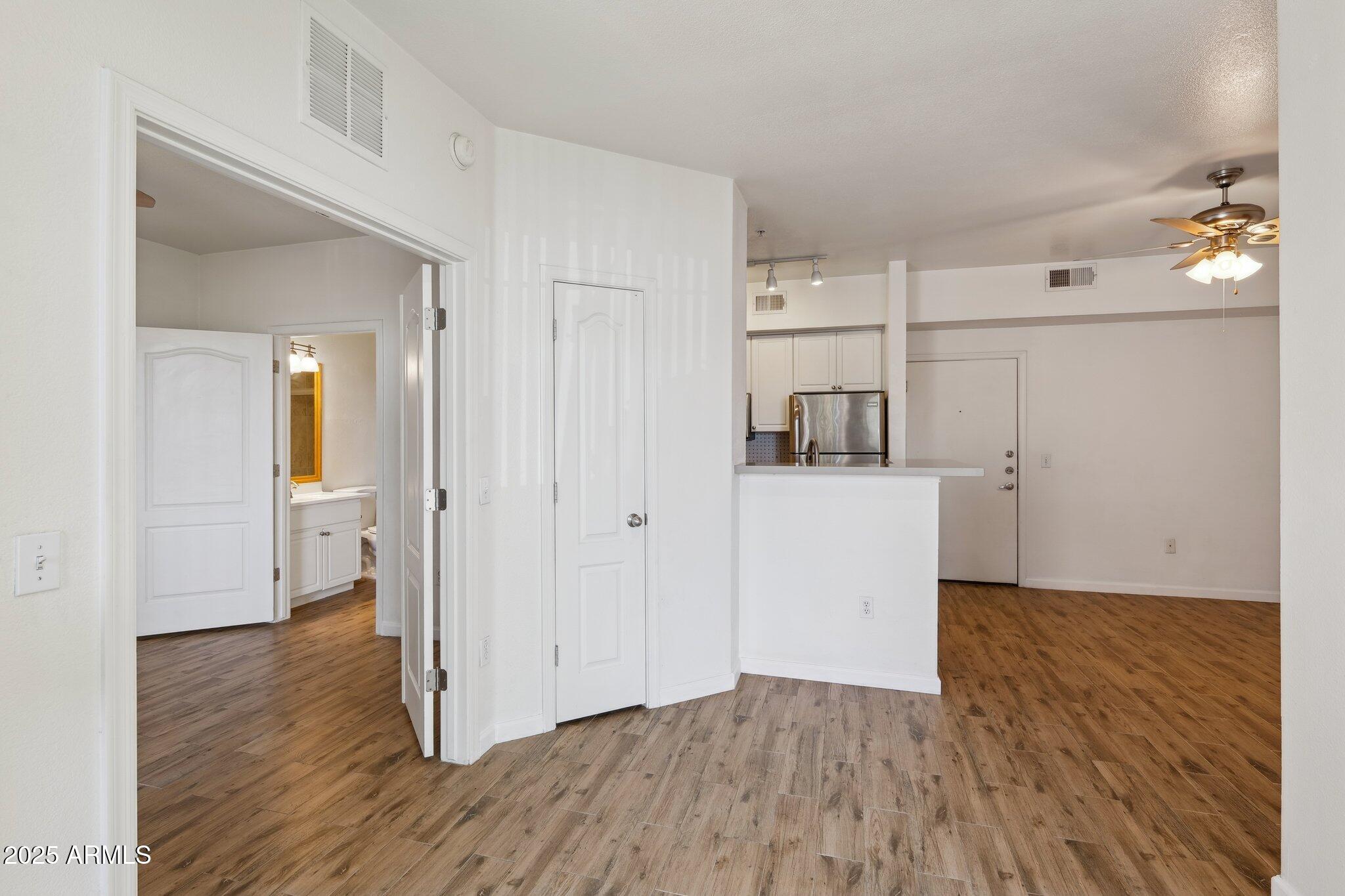 1701 East Colter Street, Unit 182 Phoenix, AZ 85016 - Photo 13 of 55 a view of a kitchen with wooden floor and a sink