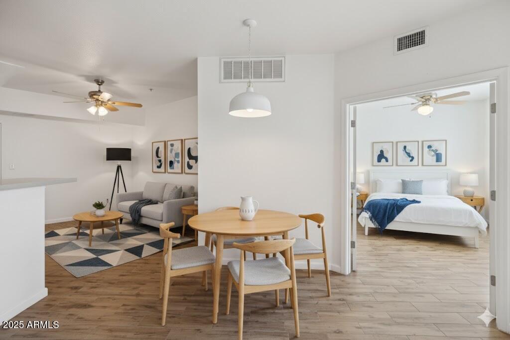 1701 East Colter Street, Unit 182 Phoenix, AZ 85016 - Photo 2 of 55 a living room with furniture and a wooden floor