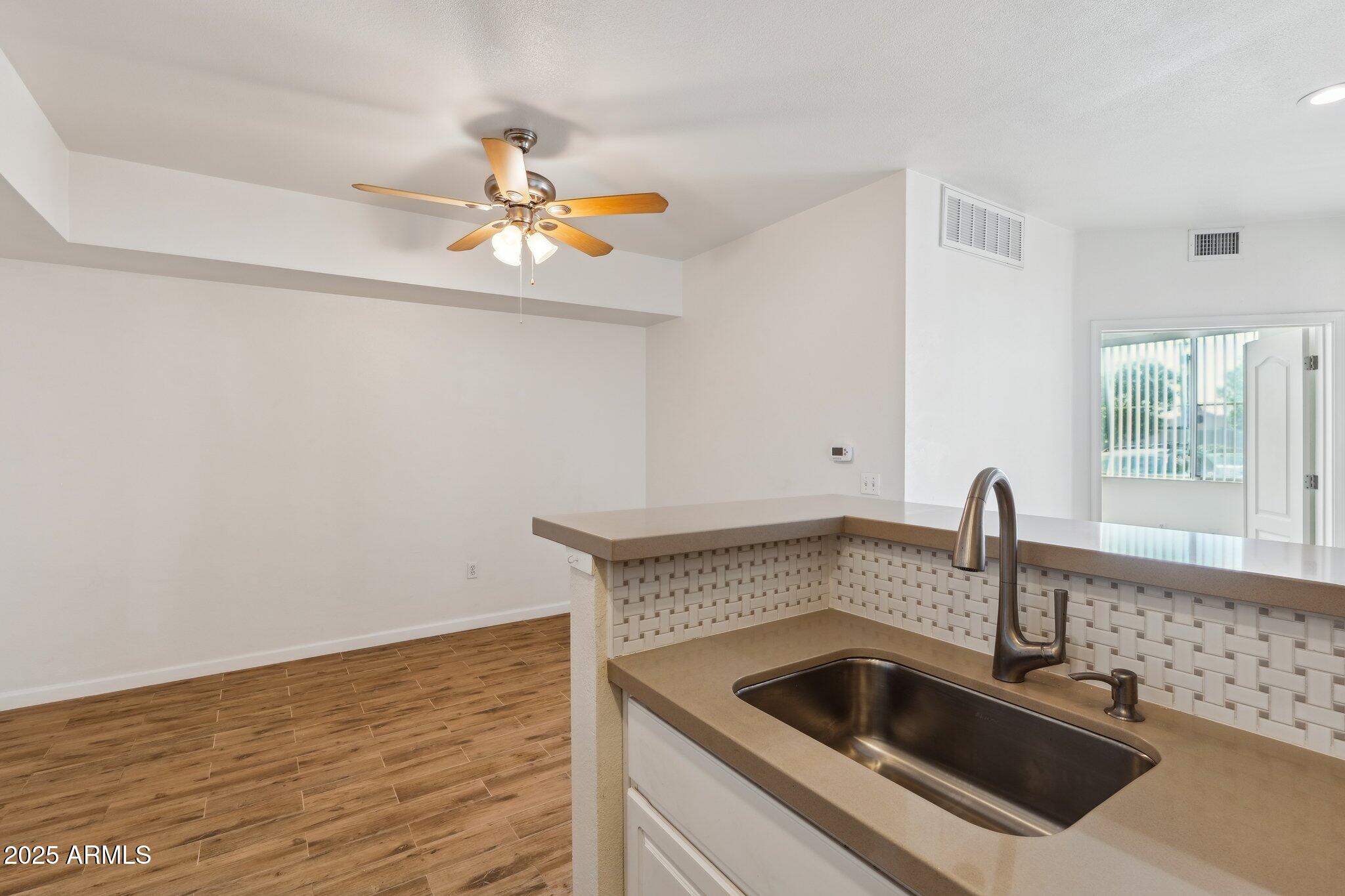 1701 East Colter Street, Unit 182 Phoenix, AZ 85016 - Photo 9 of 55 a kitchen with a sink and a window