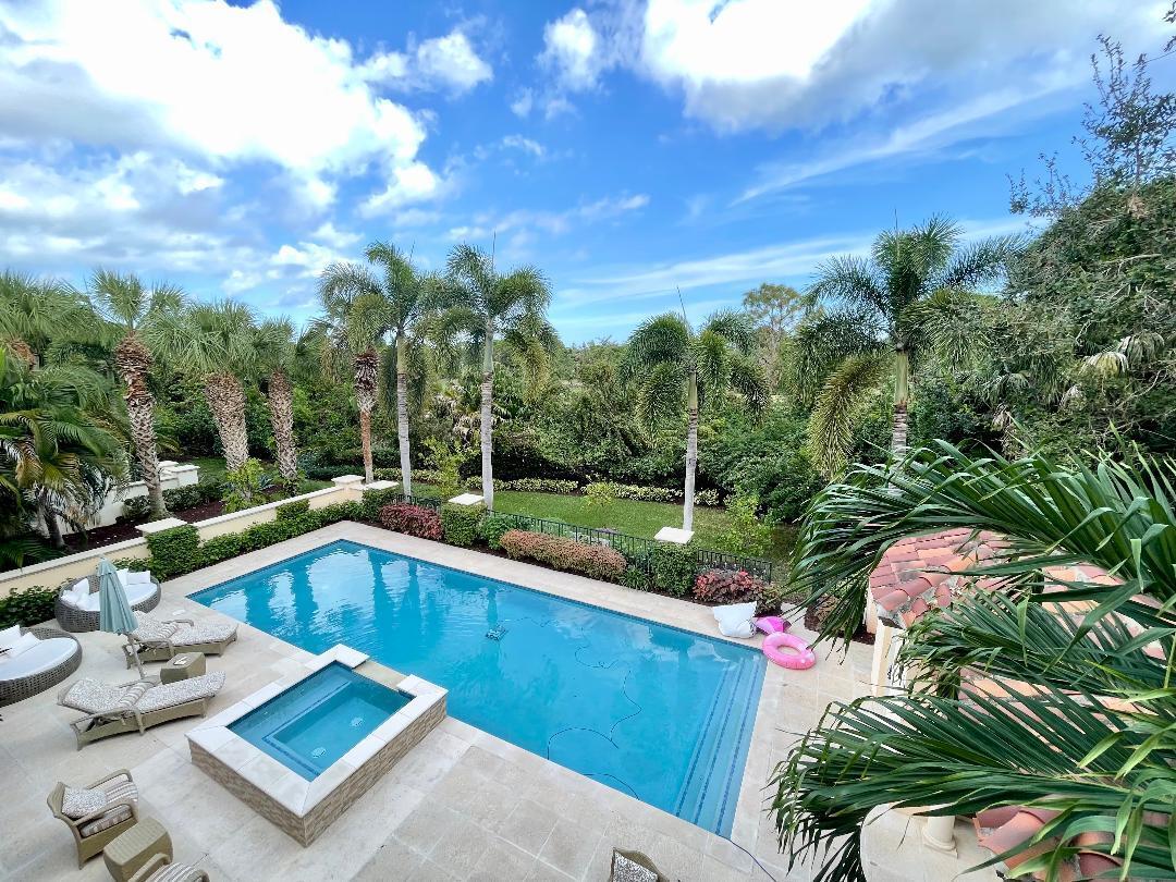 a view of a swimming pool with a patio