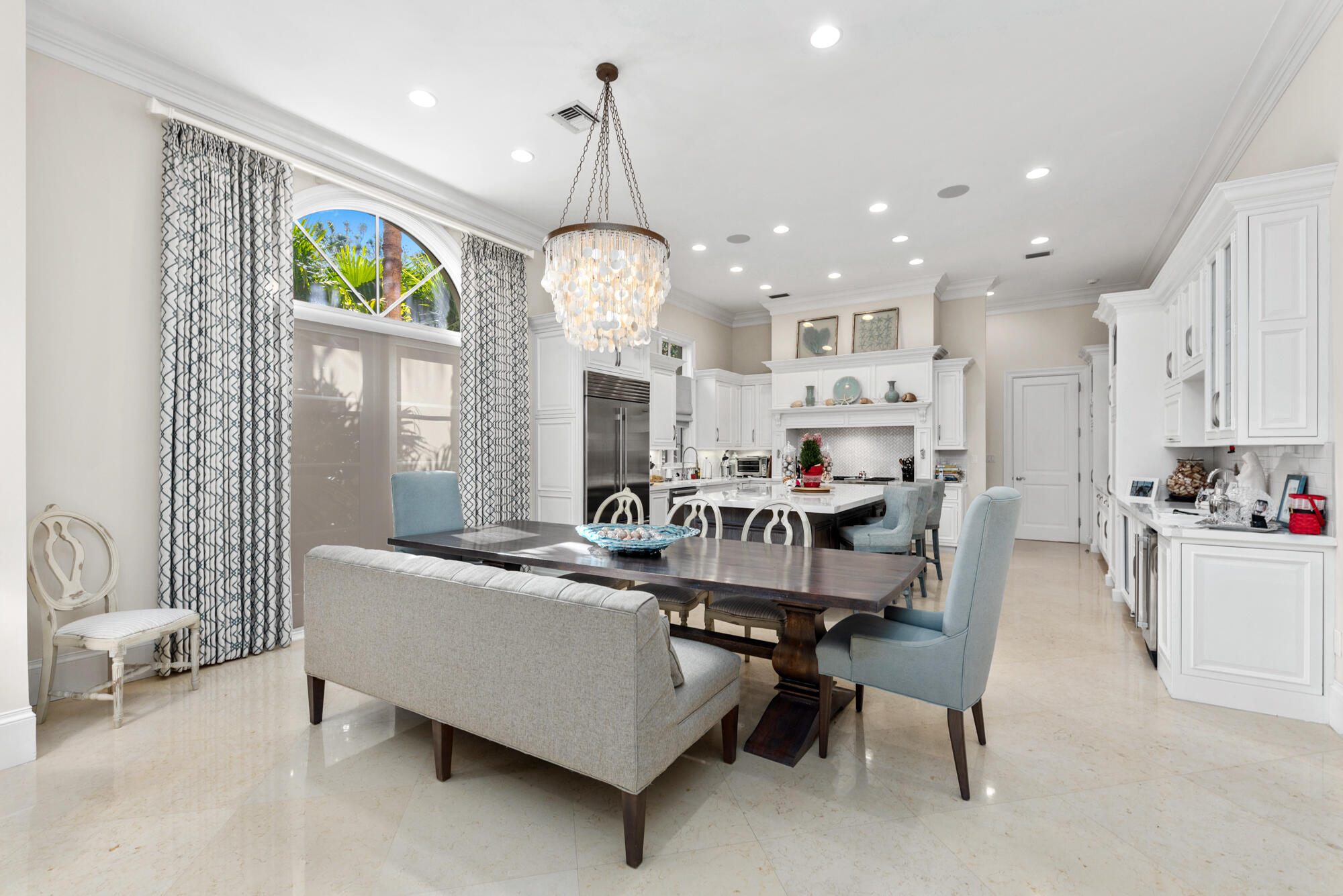 503 Bald Eagle Drive Jupiter, FL 33477 - Photo 12 of 62 a living room with furniture kitchen and a chandelier