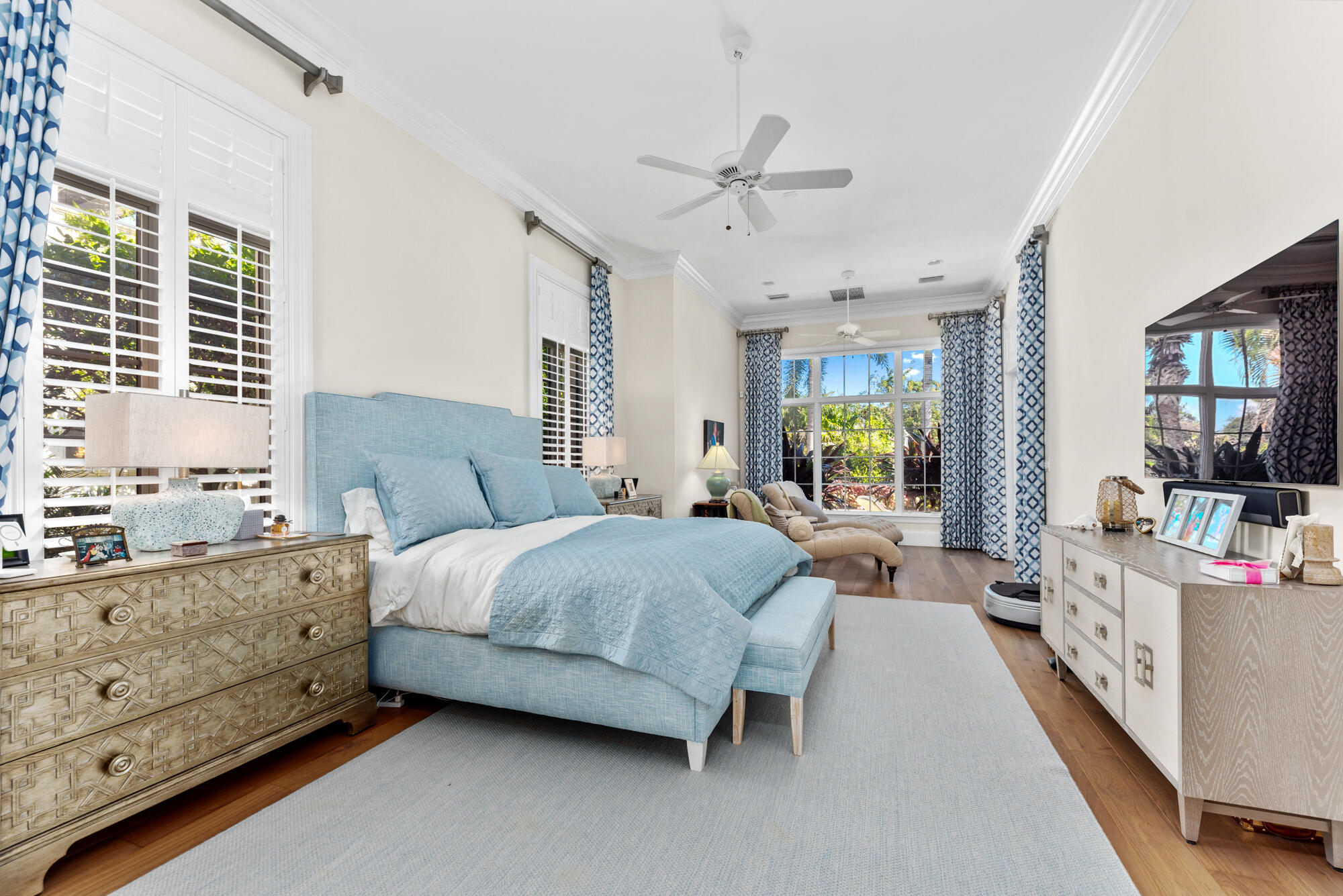 503 Bald Eagle Drive Jupiter, FL 33477 - Photo 14 of 62 a spacious bedroom with a bed and ceiling fan