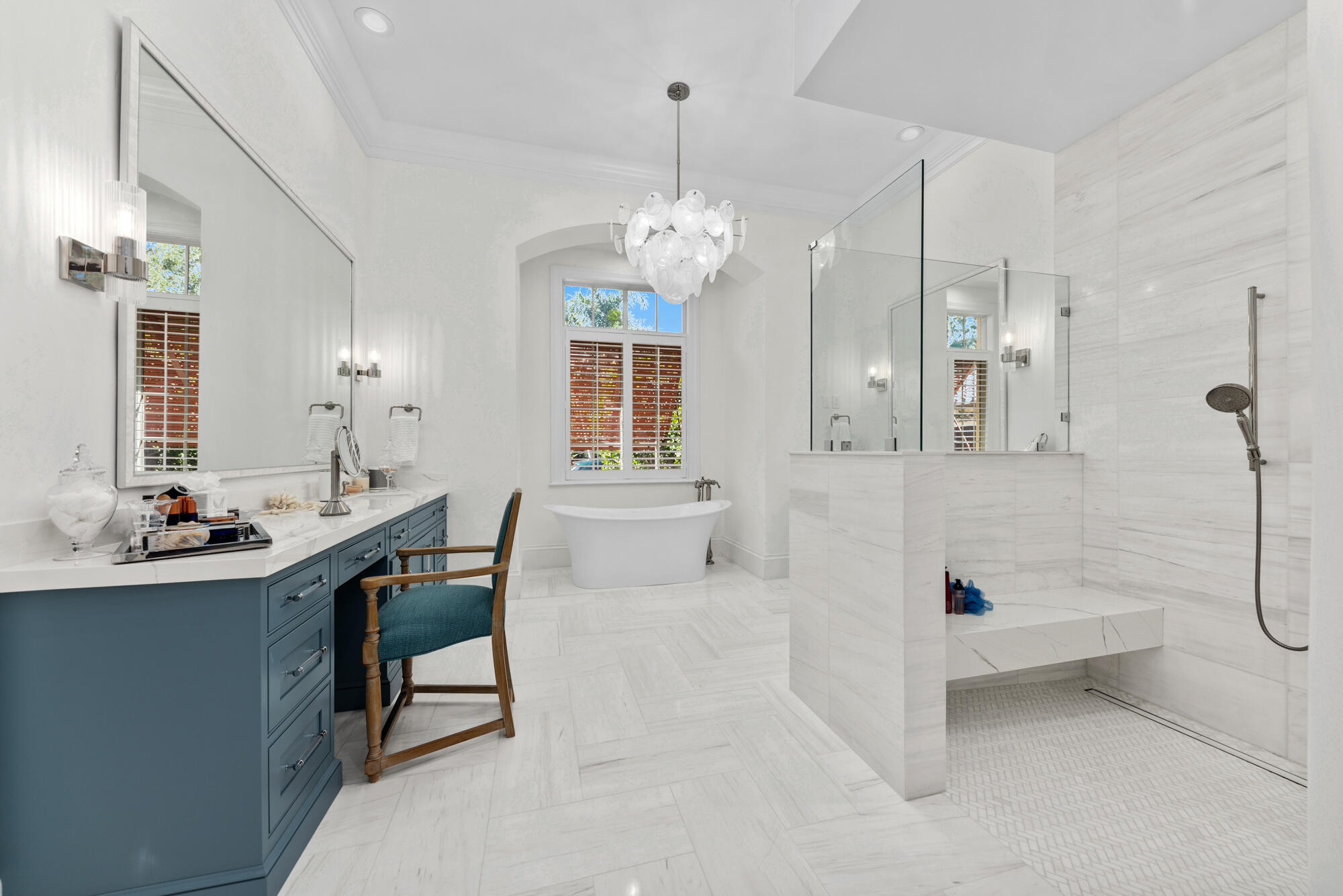 503 Bald Eagle Drive Jupiter, FL 33477 - Photo 16 of 62 a bathroom with a sink a mirror and a shower