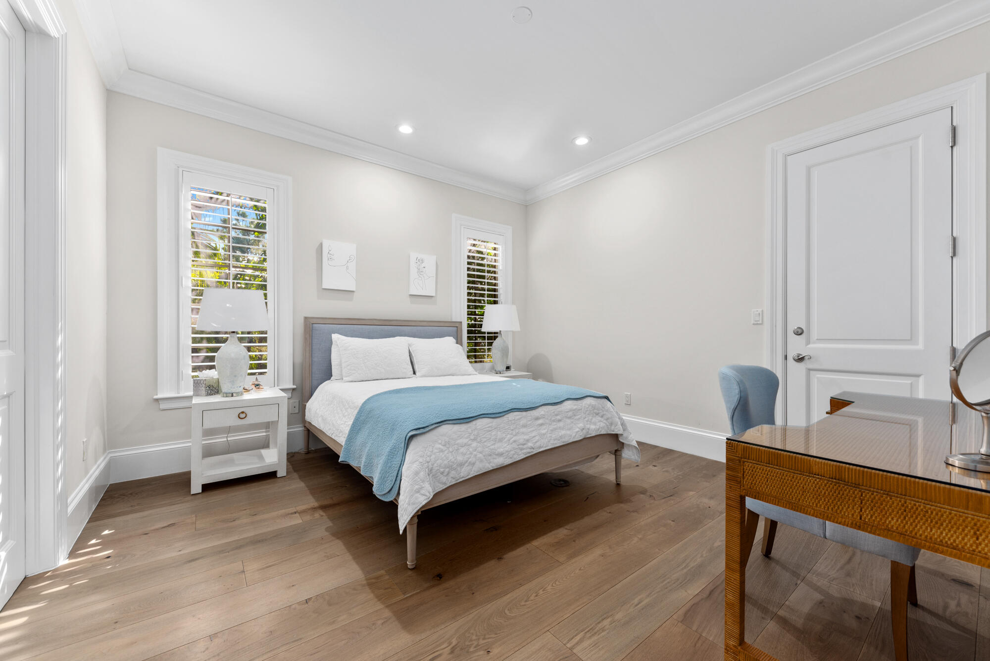 503 Bald Eagle Drive Jupiter, FL 33477 - Photo 19 of 62 a bedroom with a bed and a table in it