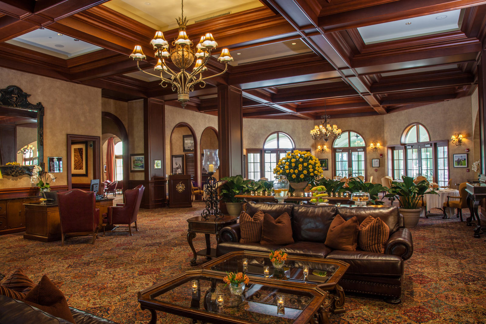 503 Bald Eagle Drive Jupiter, FL 33477 - Photo 58 of 62 a living room with furniture a chandelier and a fireplace