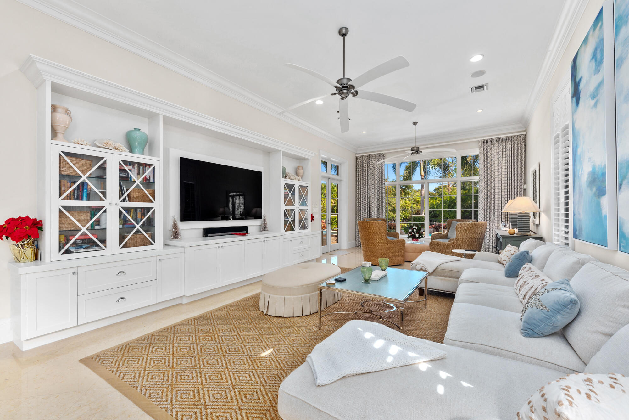 503 Bald Eagle Drive Jupiter, FL 33477 - Photo 7 of 62 a living room with furniture a flat screen tv and a view of kitchen