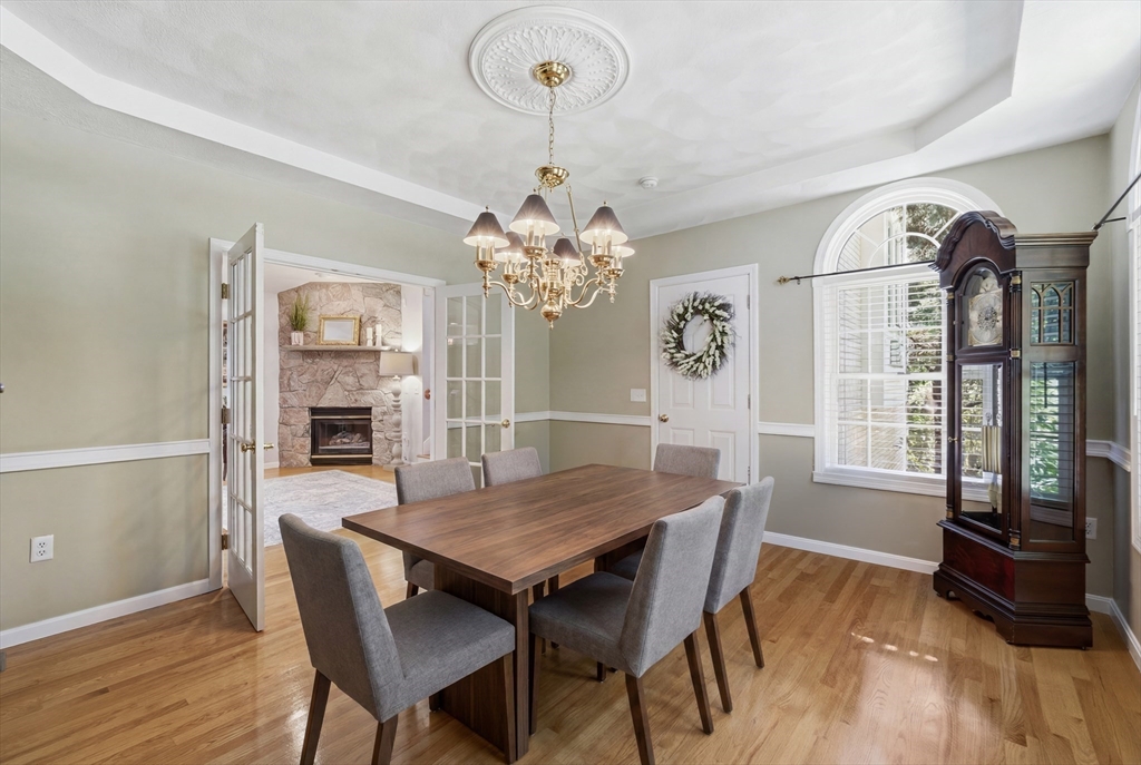 25 Haymeadow Road Boxford, MA 01921 - Photo 8 of 42 a view of a dining room with furniture window and wooden floor