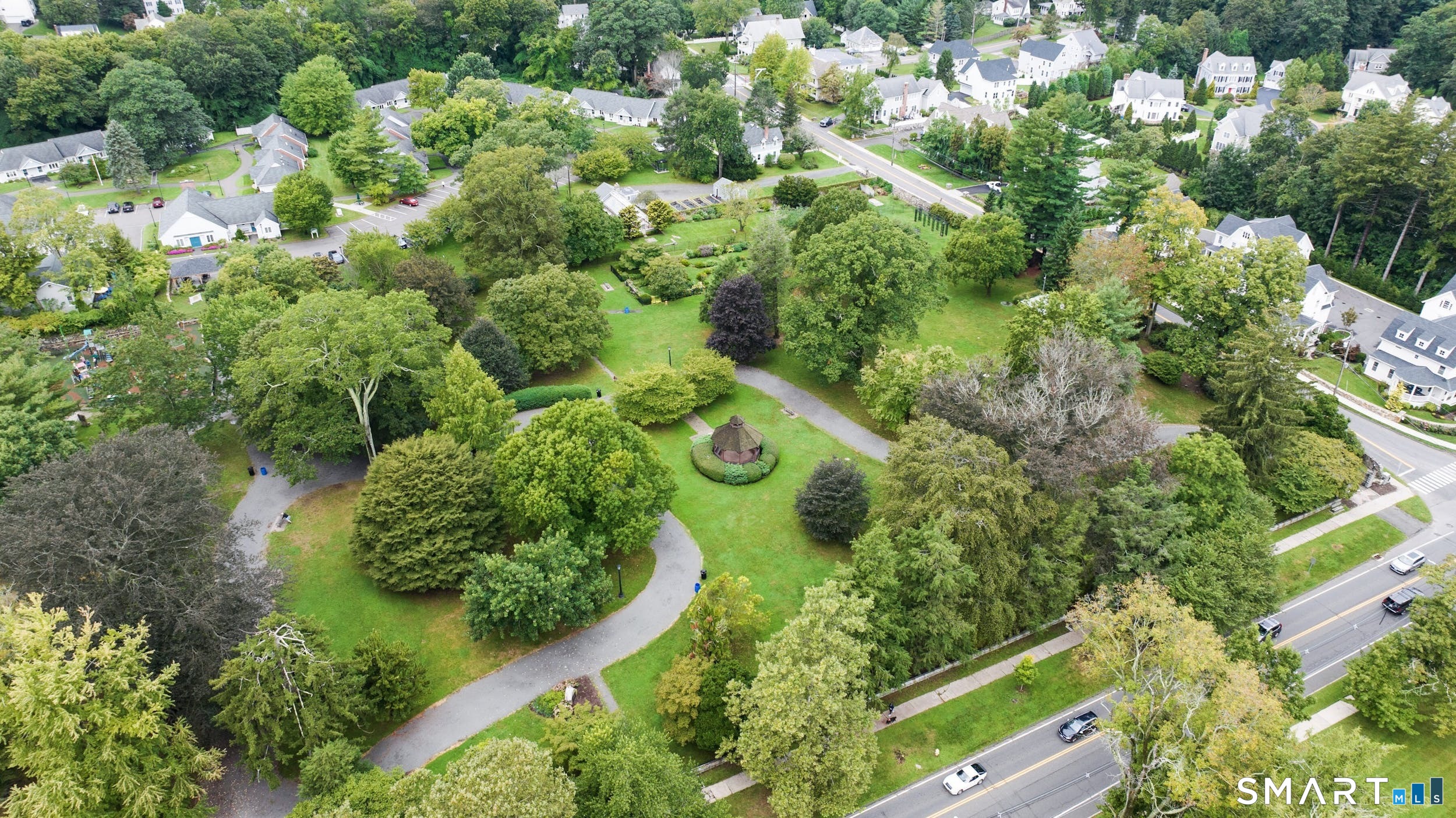 36 Catoonah Street, Unit 18 Ridgefield, CT 06877 - Photo 36 of 40 an aerial view of a residential houses with yard and parking spaces