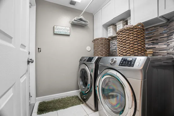 a utility room with dryer and washer
