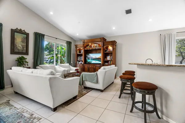 a living room with furniture and a large window