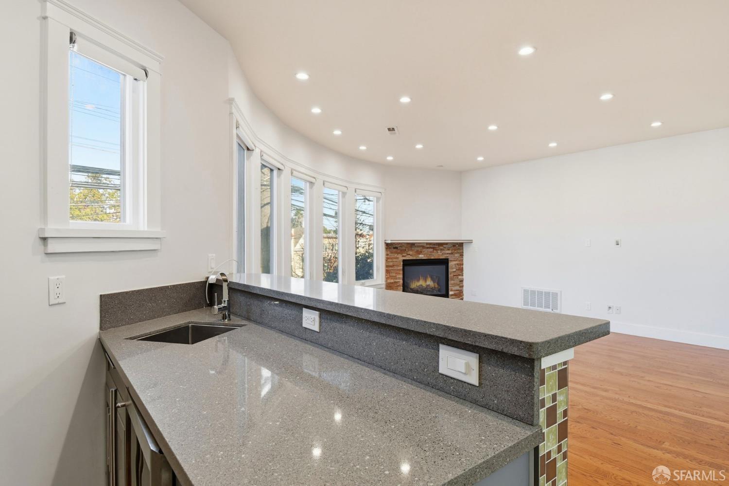 526 Silver Avenue San Francisco, CA 94112 - Photo 12 of 44 a kitchen with a sink a stove and a microwave