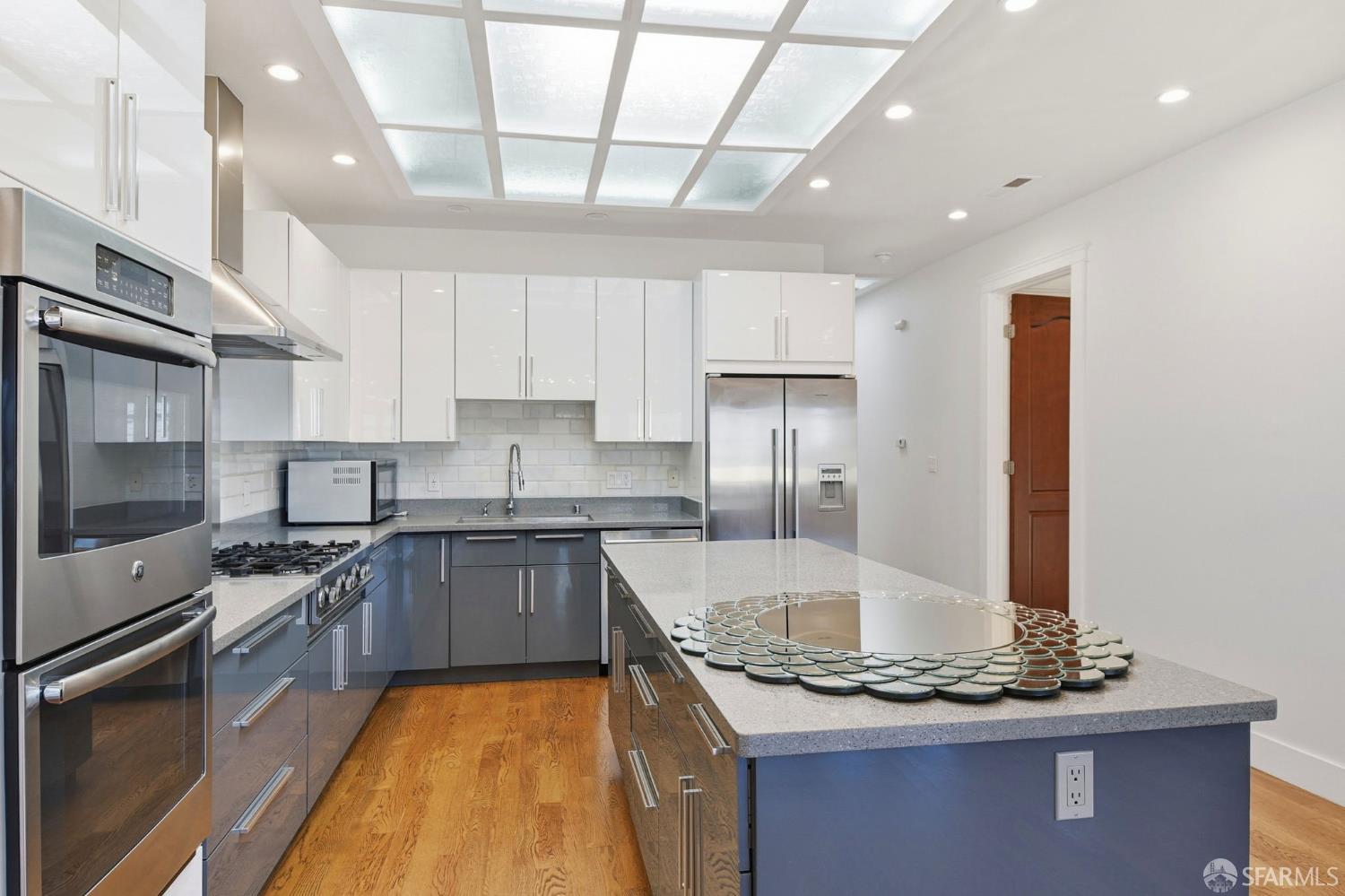 526 Silver Avenue San Francisco, CA 94112 - Photo 13 of 44 a kitchen with stainless steel appliances granite countertop a sink stove and refrigerator