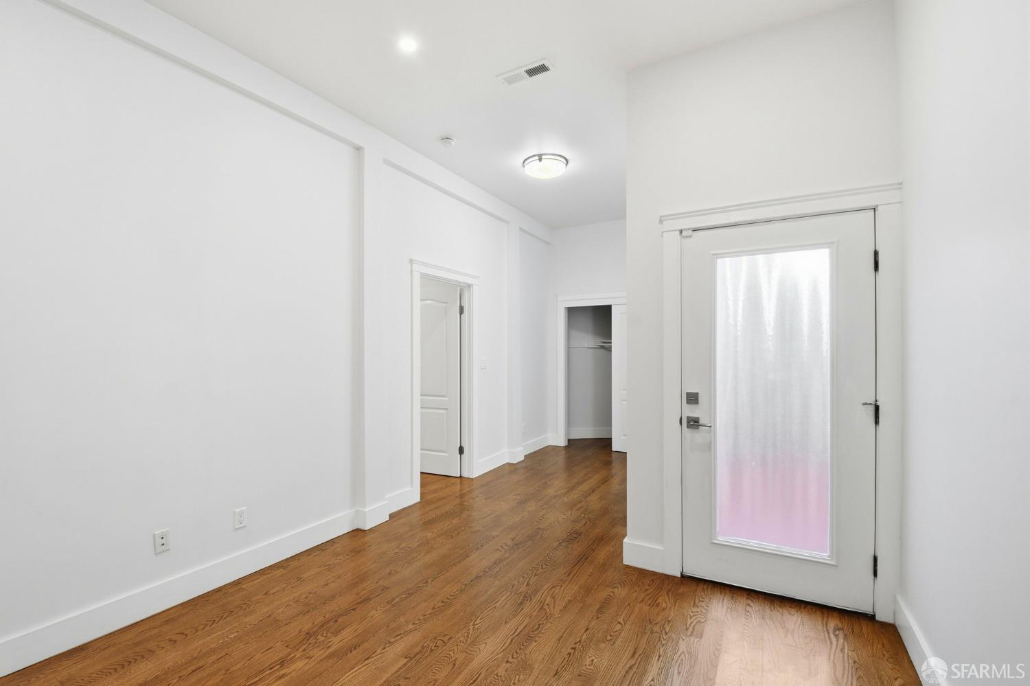 526 Silver Avenue San Francisco, CA 94112 - Photo 19 of 44 an empty room with wooden floor and closet