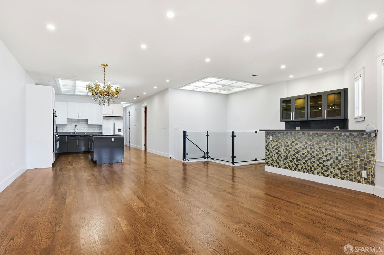 526 Silver Avenue San Francisco, CA 94112 - Photo 9 of 44 a view of a kitchen with furniture and wooden floor