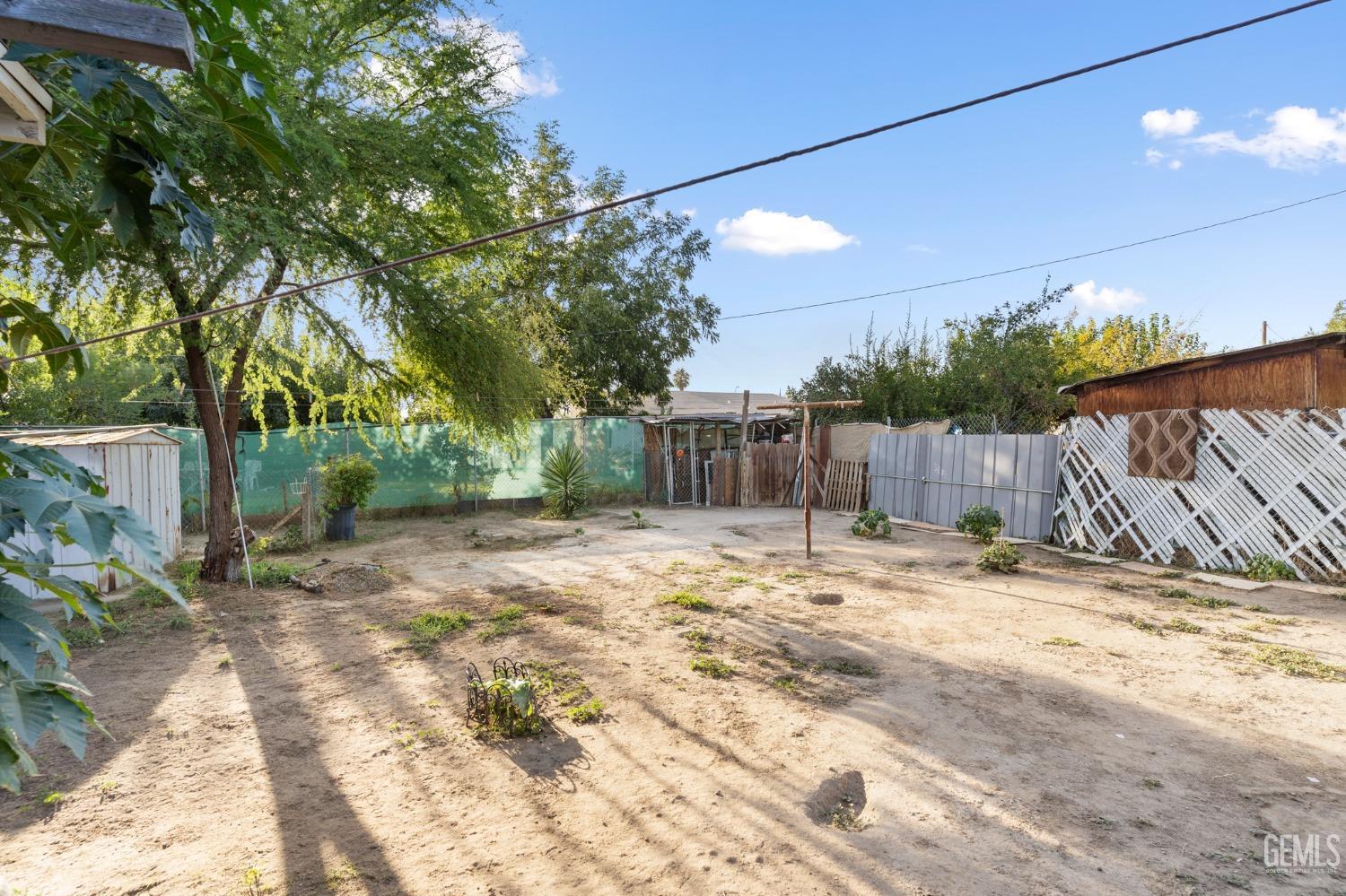 Undisclosed Address Arvin, CA 93203 - Photo 16 of 19 a backyard of a house