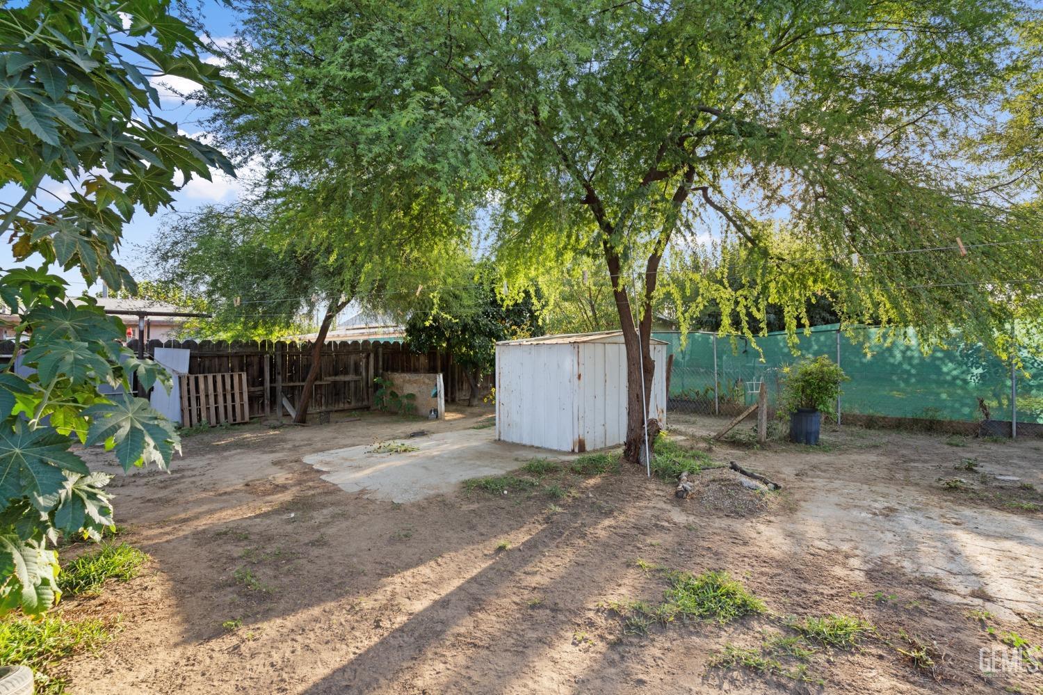 Undisclosed Address Arvin, CA 93203 - Photo 17 of 19 a backyard of a house with lots of green space