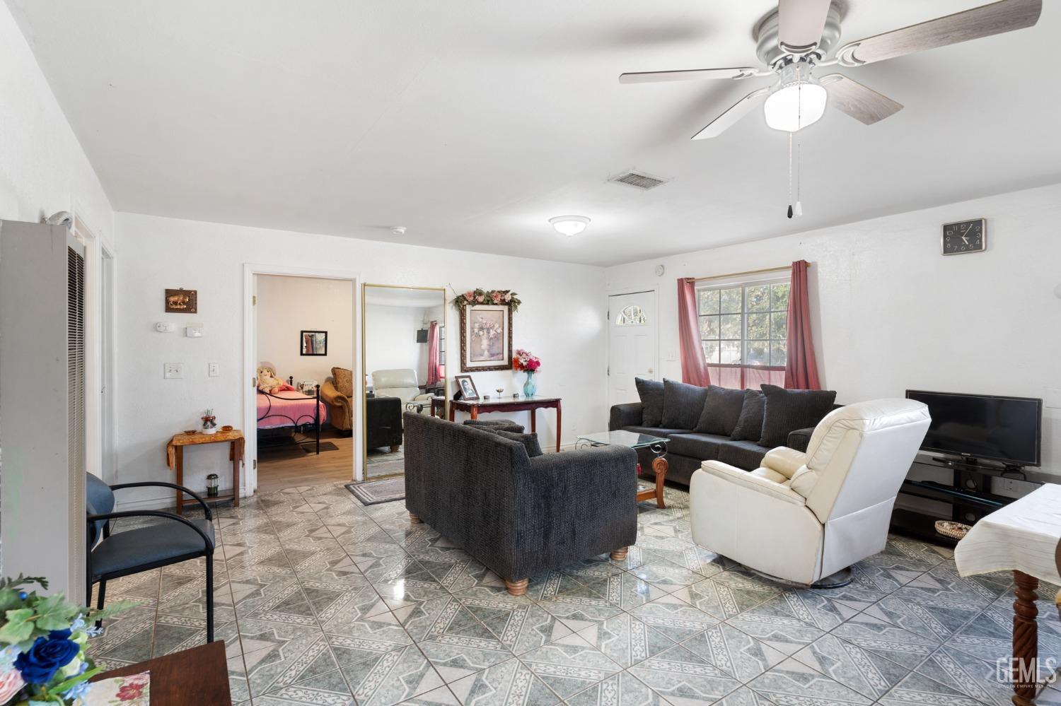 Undisclosed Address Arvin, CA 93203 - Photo 6 of 19 a living room with furniture and a window