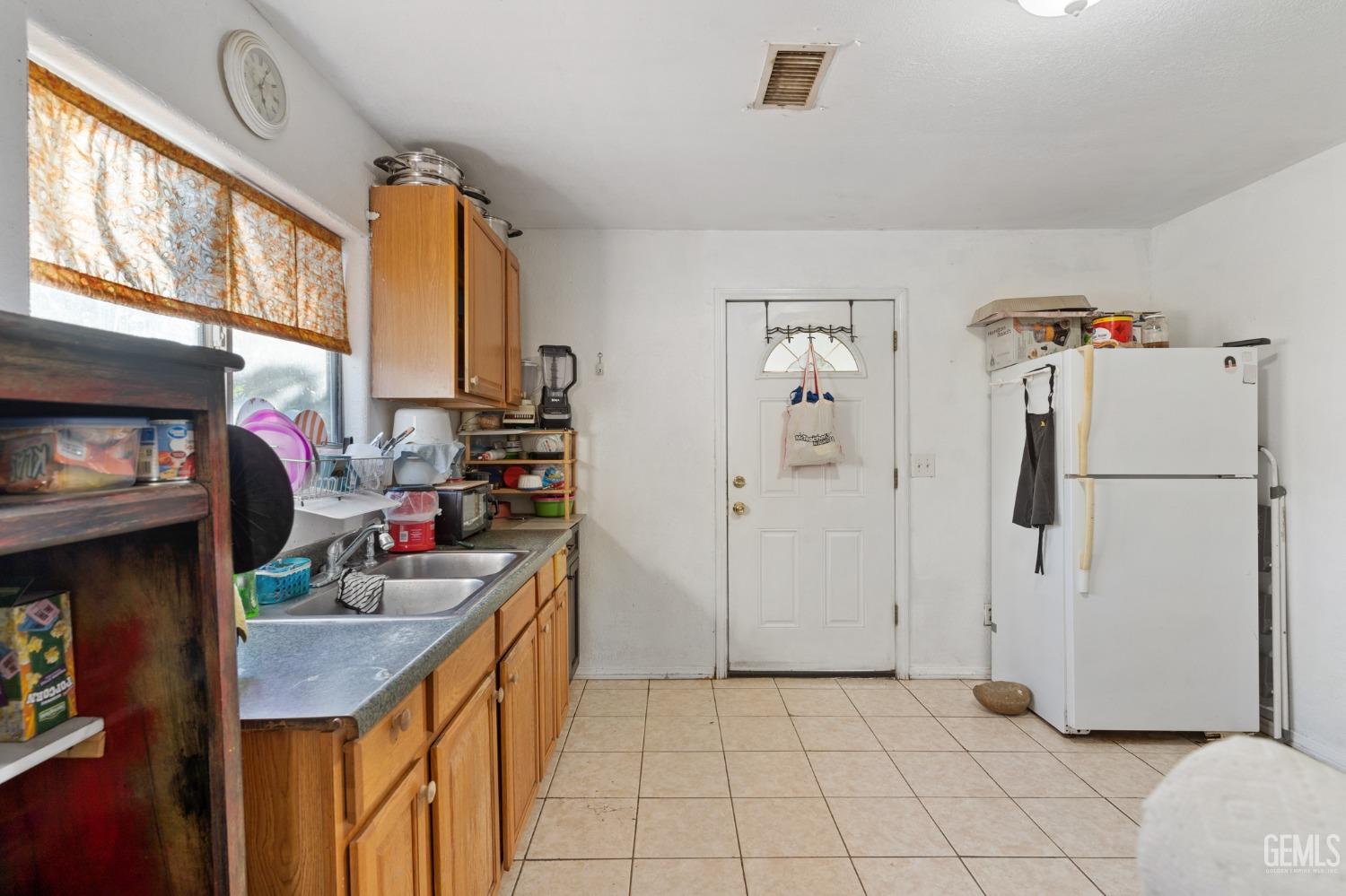 Undisclosed Address Arvin, CA 93203 - Photo 7 of 19 a kitchen with stainless steel appliances granite countertop a refrigerator a stove and a sink with cabinets