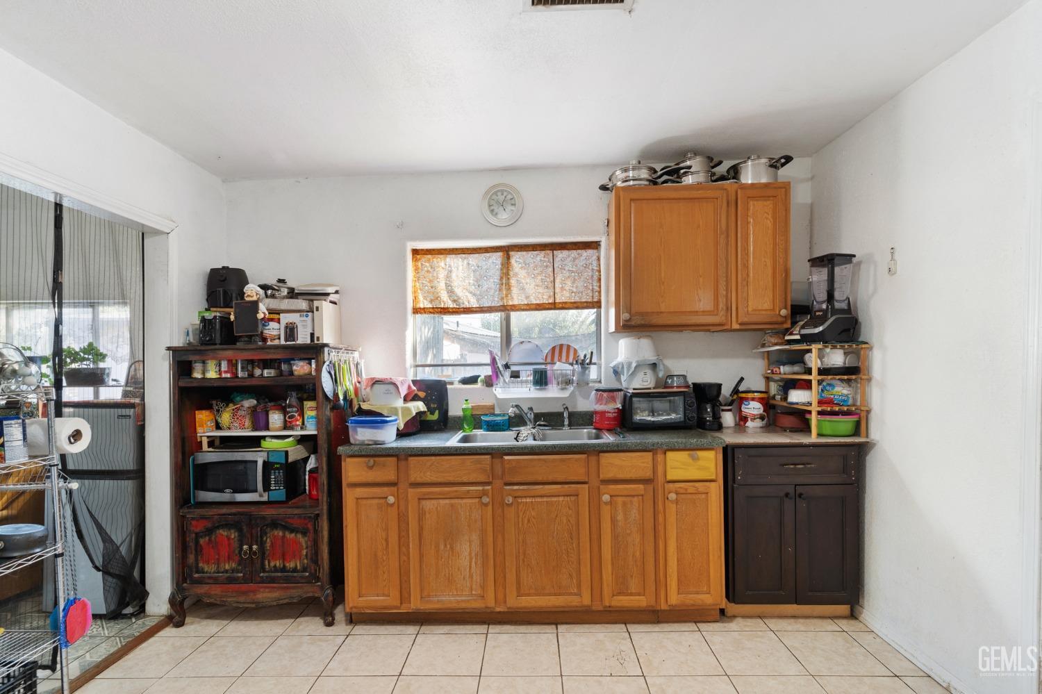 Undisclosed Address Arvin, CA 93203 - Photo 8 of 19 a kitchen with stainless steel appliances a sink and a stove
