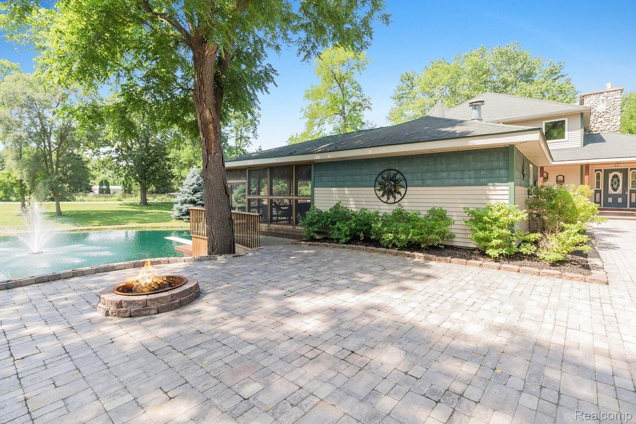 1680 Fisk Road Howell, MI 48843 - Photo 18 of 49 Brick patio w/ firepit