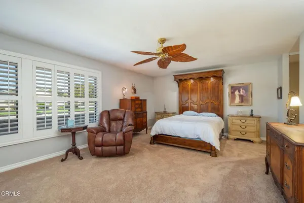 a bed room with a bed and a couch