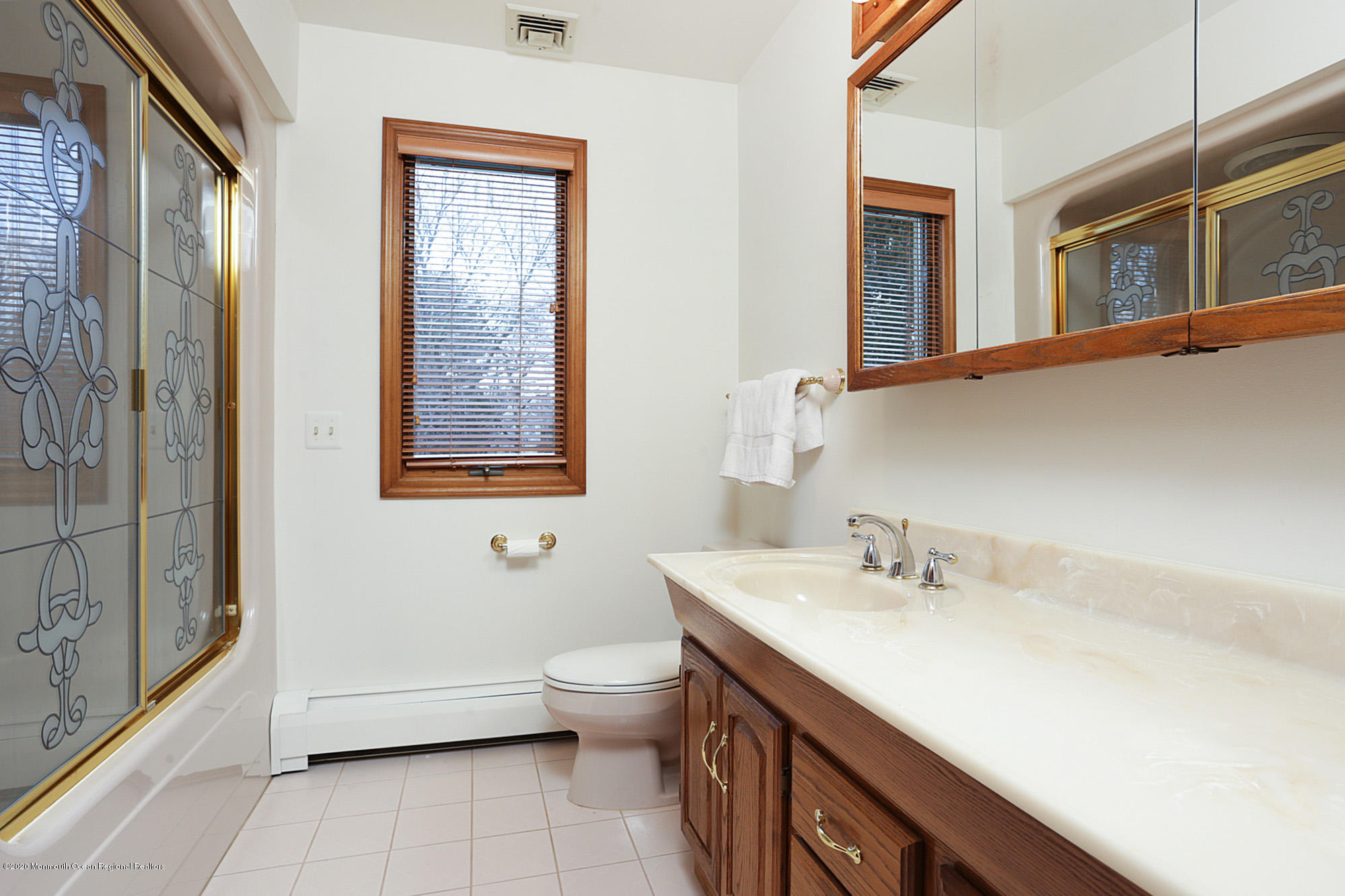 1350 Church Road Toms River, NJ 08755 - Photo 15 of 28 a bathroom with a sink and a mirror