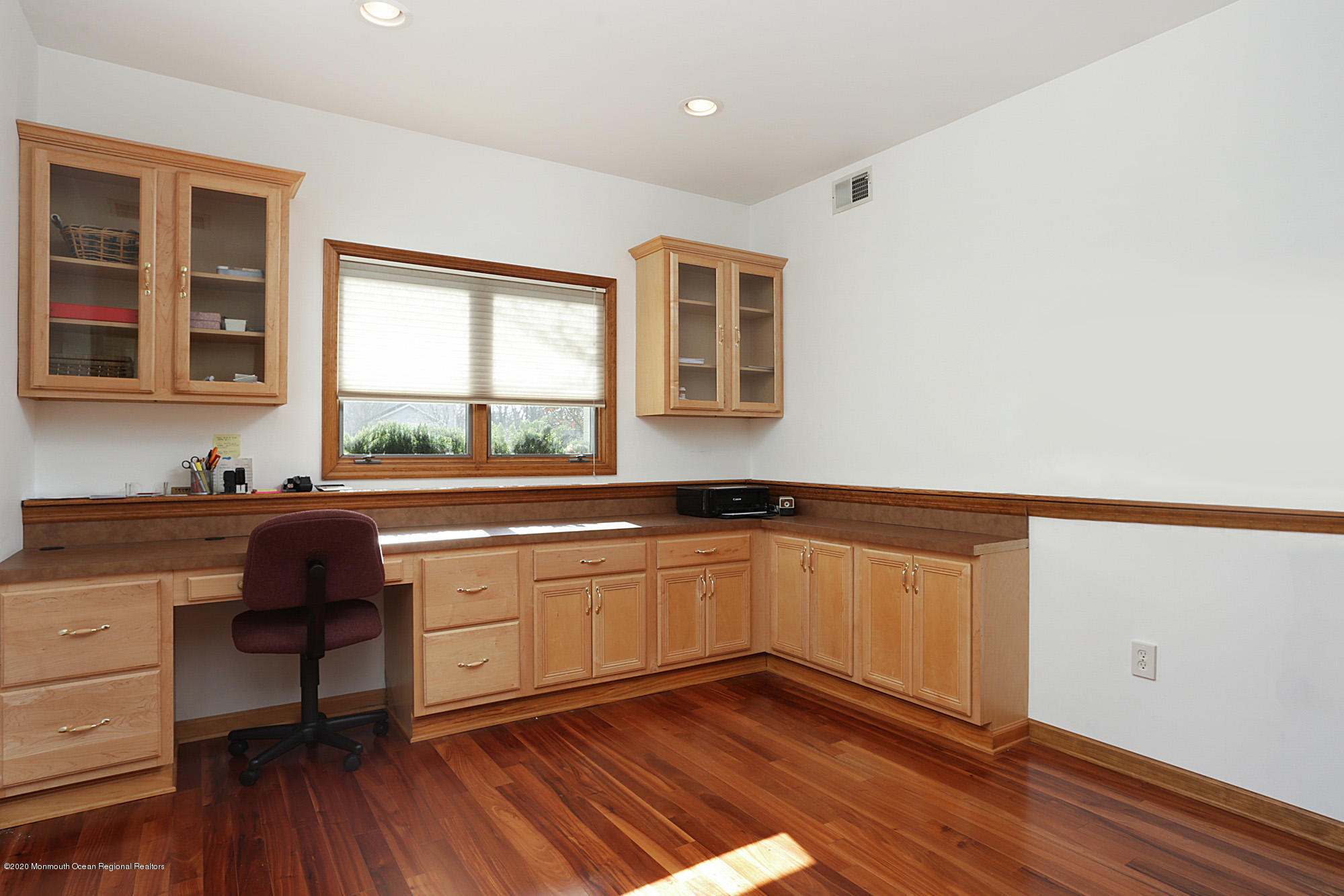 1350 Church Road Toms River, NJ 08755 - Photo 18 of 28 a kitchen with granite countertop a stove a sink and white cabinets with wooden floor next to windows