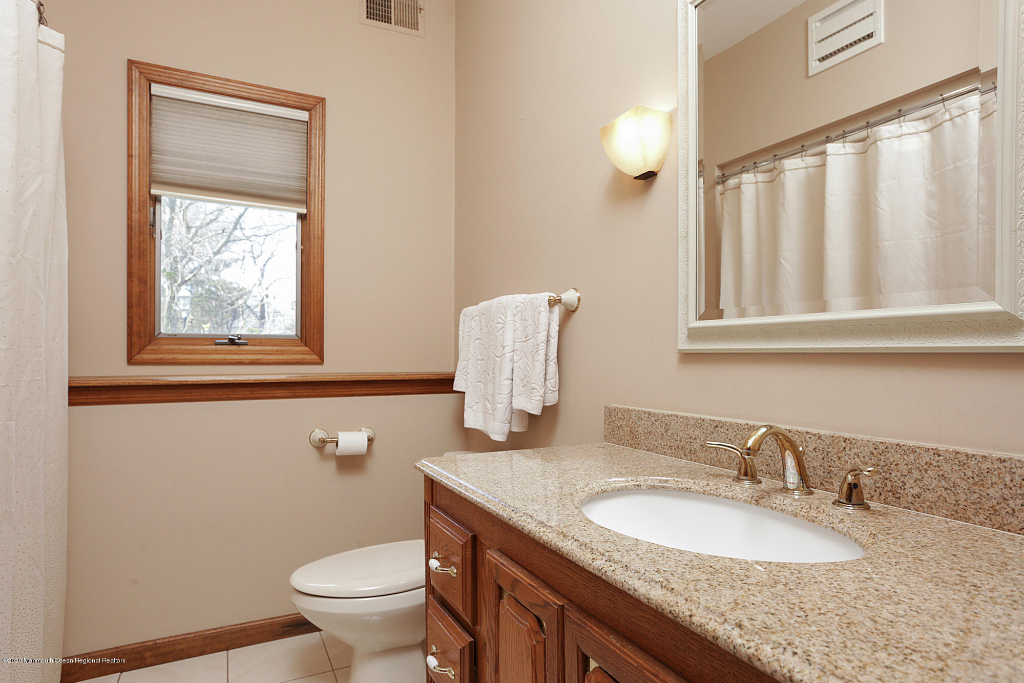 1350 Church Road Toms River, NJ 08755 - Photo 19 of 28 a bathroom with a granite countertop toilet a sink and a mirror