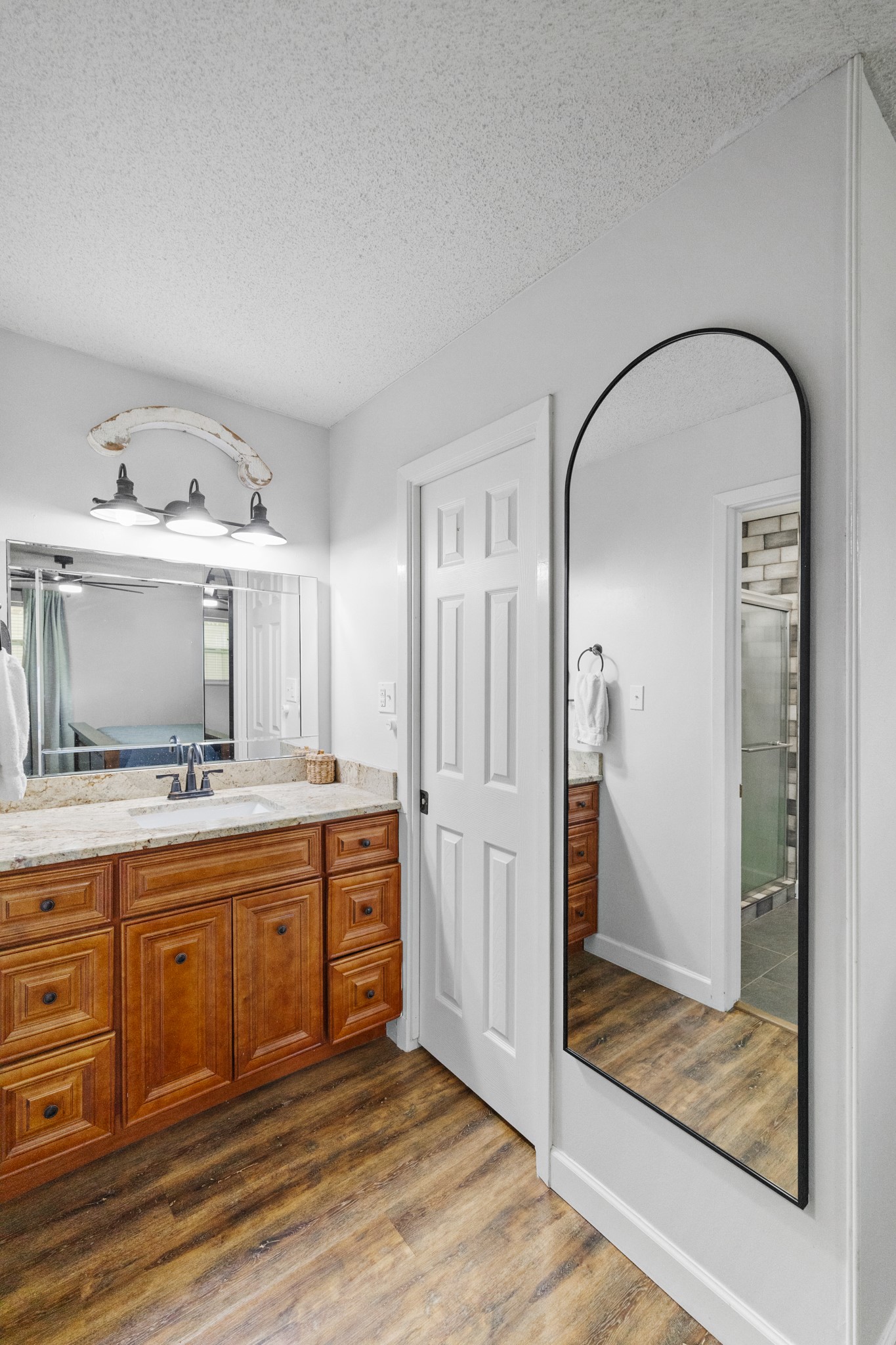 1003 Virginia Street Edna, TX 77957 - Photo 12 of 30 a large bathroom with a glass door shower and sink