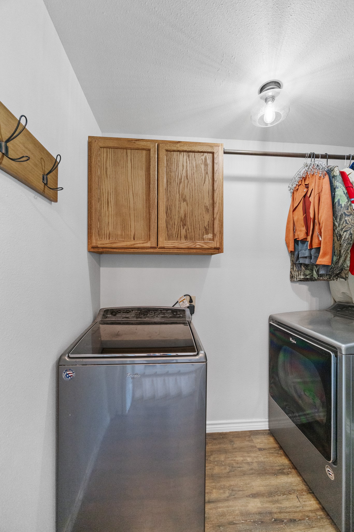 1003 Virginia Street Edna, TX 77957 - Photo 22 of 30 a kitchen with a stove and a microwave