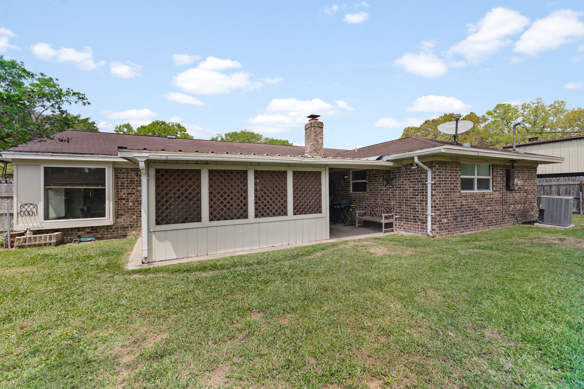 1003 Virginia Street Edna, TX 77957 - Photo 25 of 30 a front view of a house with a garden
