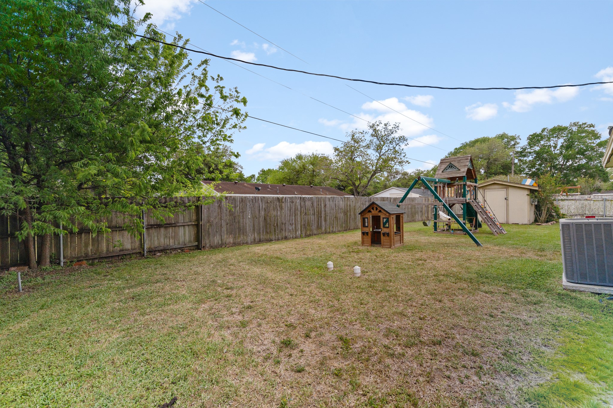 1003 Virginia Street Edna, TX 77957 - Photo 27 of 30 a backyard of a house with lots of green space