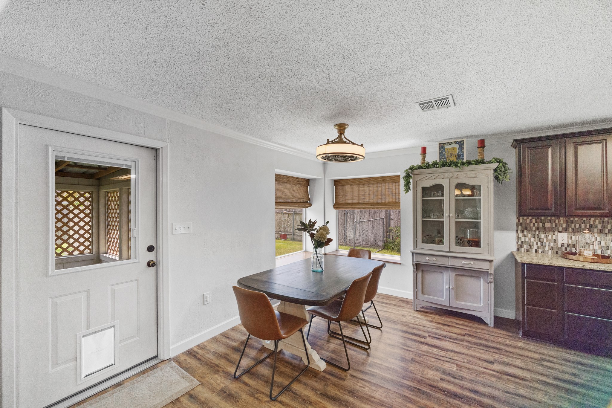 1003 Virginia Street Edna, TX 77957 - Photo 6 of 30 a view of a dining room with furniture window and wooden floor