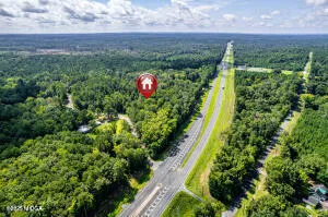 a view of a garden with a building in the background