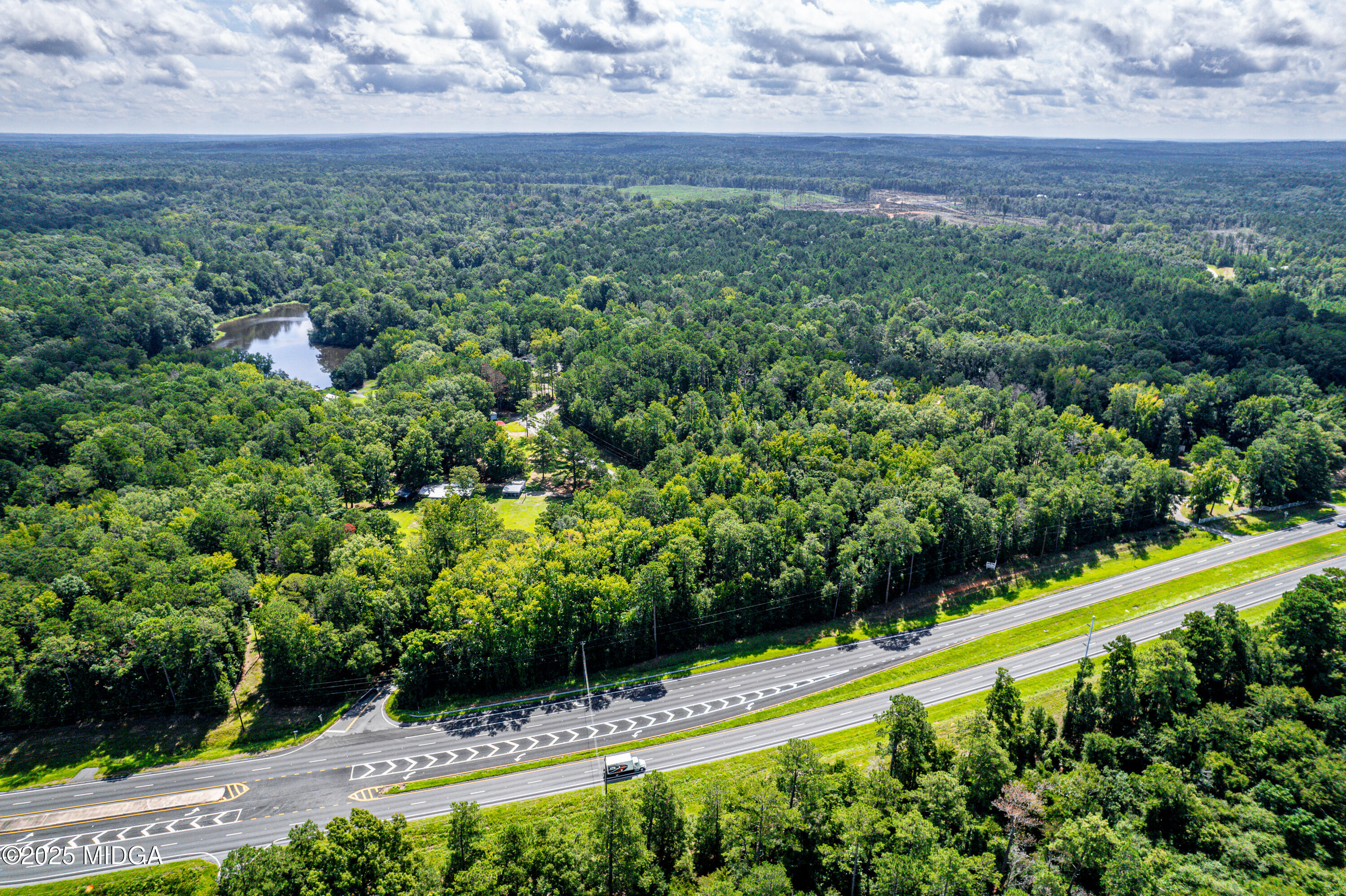 0 Braswell Lk Road Gray, GA 31032 - Photo 2 of 2 a view of a garden with a building in the background