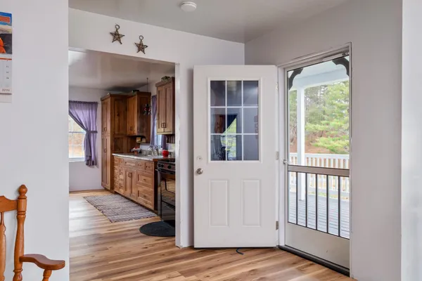 a bedroom with two beds and a dresser