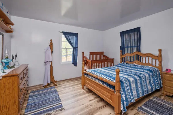 a bathroom with a window and a shower curtain