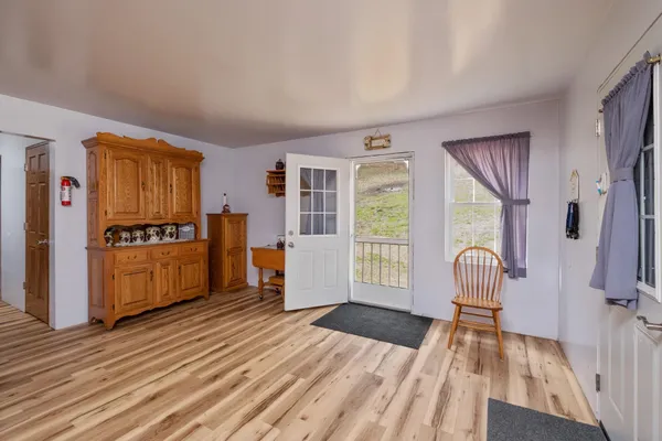 a dining room with furniture and window