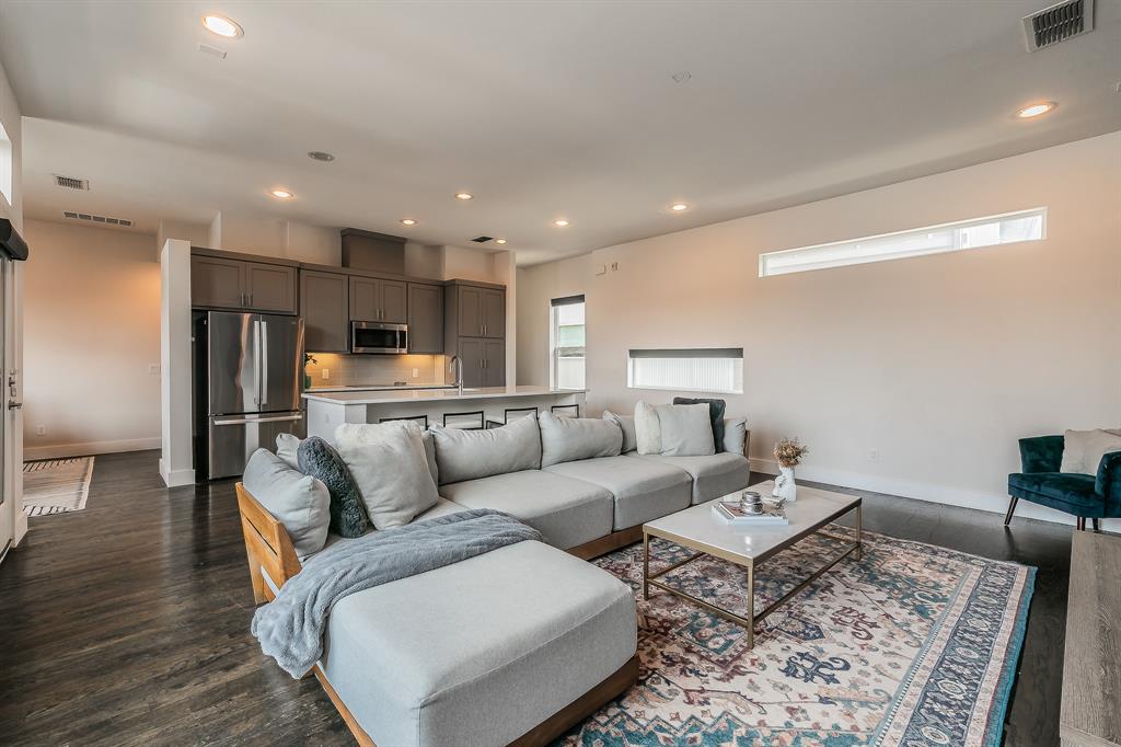 2441 Thatcher Drive Dallas, TX 75206 - Photo 15 of 35 a living room with furniture and a wooden floor