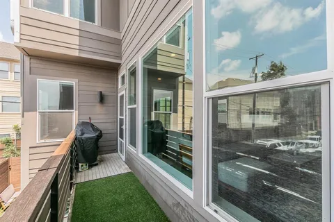 a view of a balcony with a potted plant