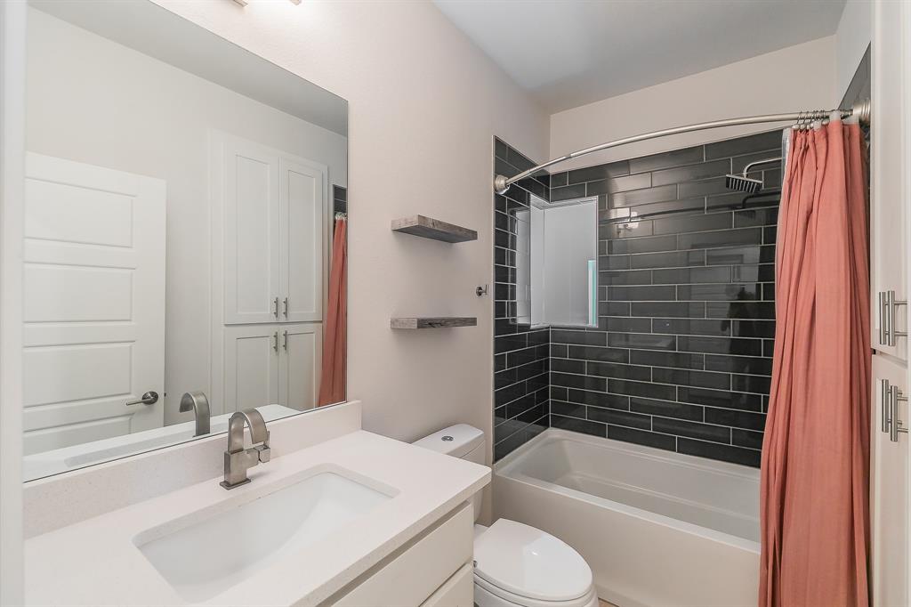2441 Thatcher Drive Dallas, TX 75206 - Photo 22 of 35 a bathroom with a sink toilet and shower