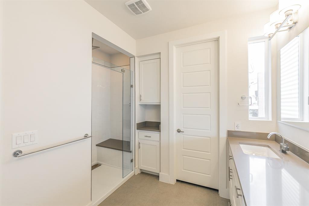 2441 Thatcher Drive Dallas, TX 75206 - Photo 28 of 35 a bathroom with a tub and a shower