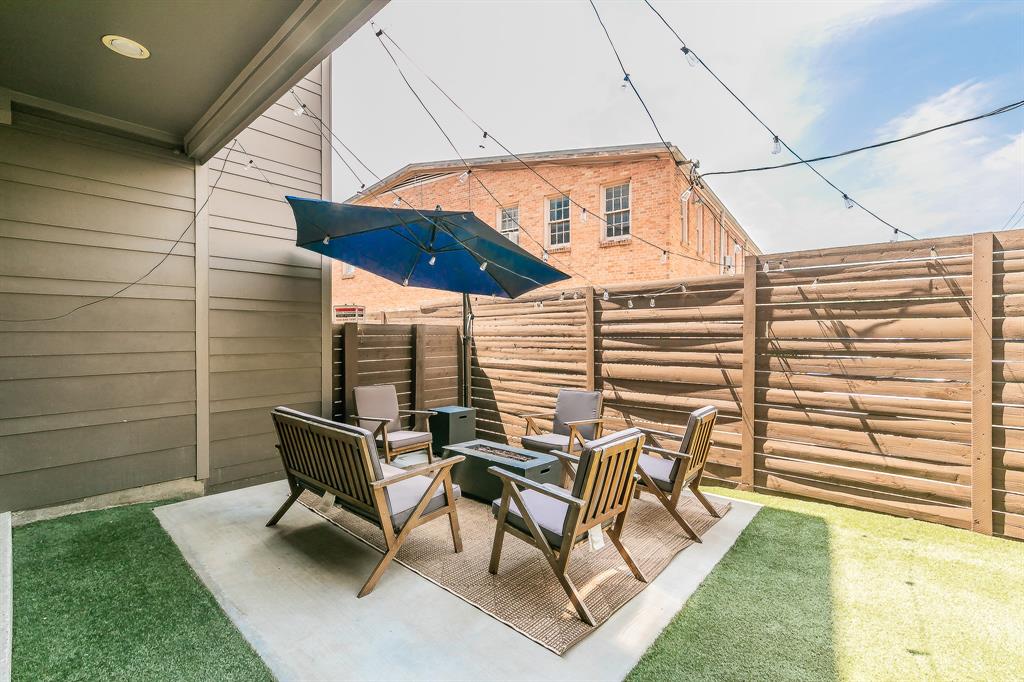 2441 Thatcher Drive Dallas, TX 75206 - Photo 29 of 35 a view of a patio with table and chairs and couches