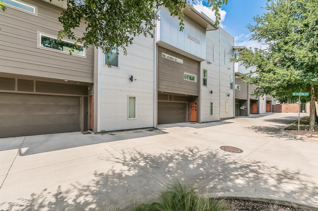 2441 Thatcher Drive Dallas, TX 75206 - Photo 35 of 35 a front view of a house with a yard and garage