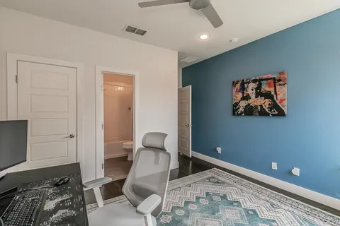 a bedroom with a bed and a couch