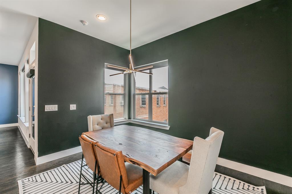 2441 Thatcher Drive Dallas, TX 75206 - Photo 9 of 35 a view of a dining room with furniture window and wooden floor