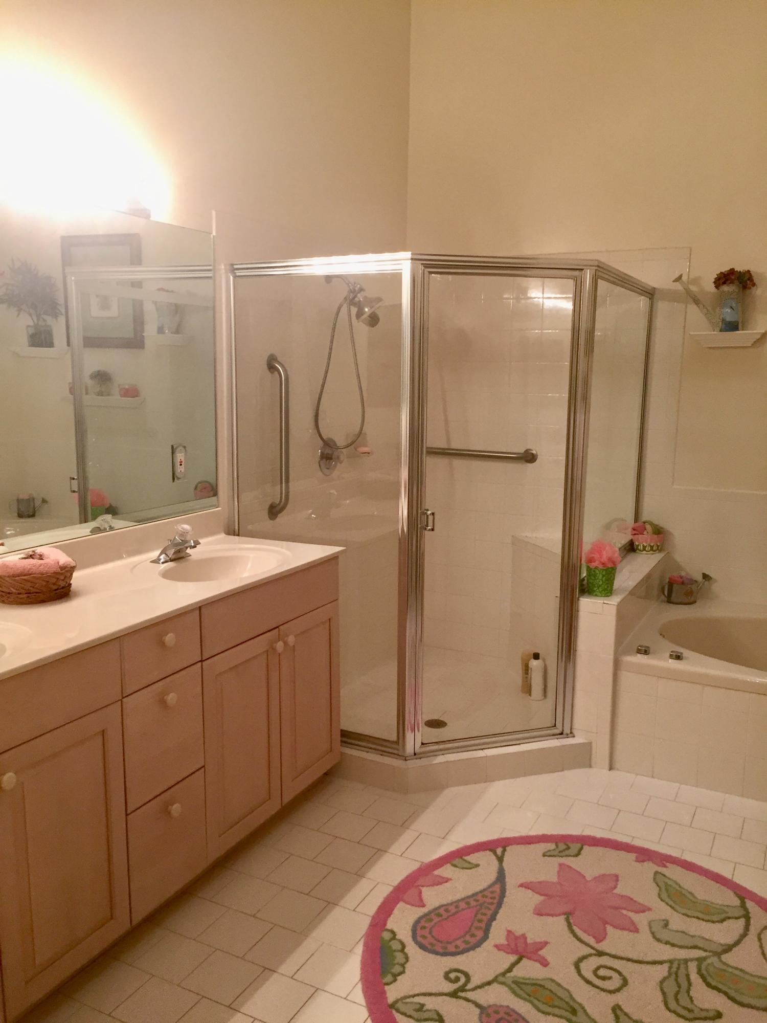 8349 Horseshoe Bay Road Boynton Beach, FL 33472 - Photo 14 of 20 a bathroom with a tub sink and mirror