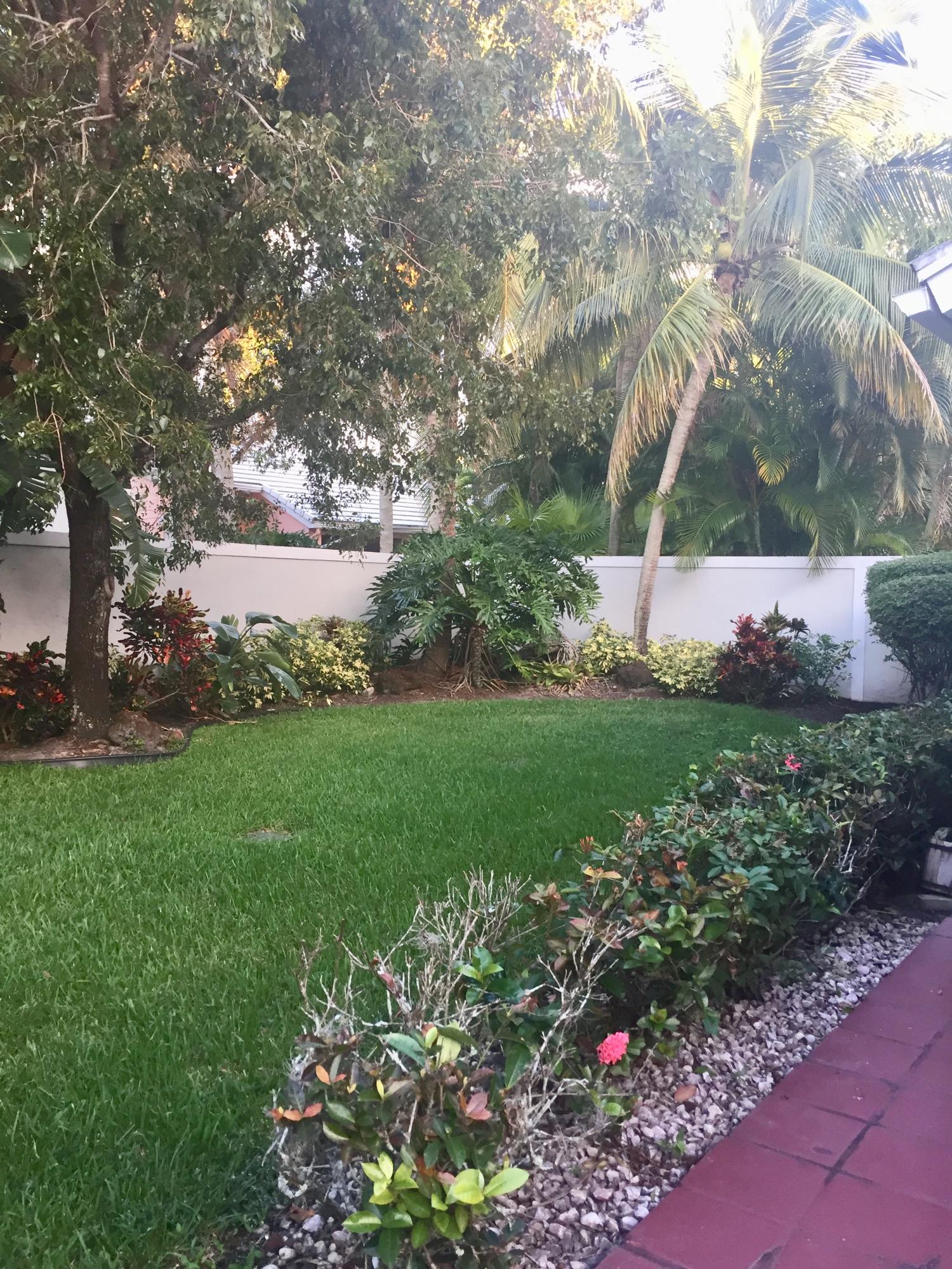 8349 Horseshoe Bay Road Boynton Beach, FL 33472 - Photo 18 of 20 a view of a garden with large trees